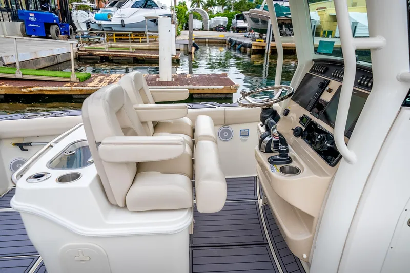 My Sherry III Yacht Photos Pics 2018 Boston Whaler 280 Outrage boat interior with helm and seating at marina.