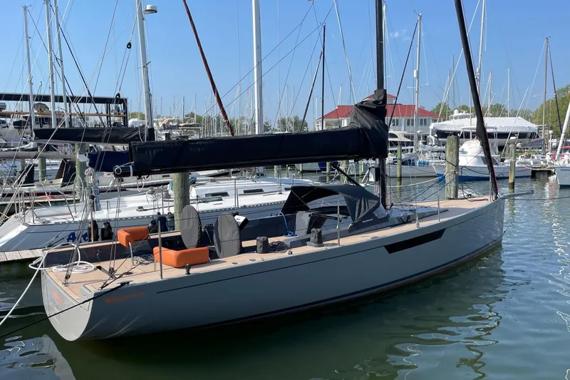 Saffire Yacht Photos Pics 2022 Saffier 33 Life sailboat docked in a marina, featuring sleek design and modern amenities.