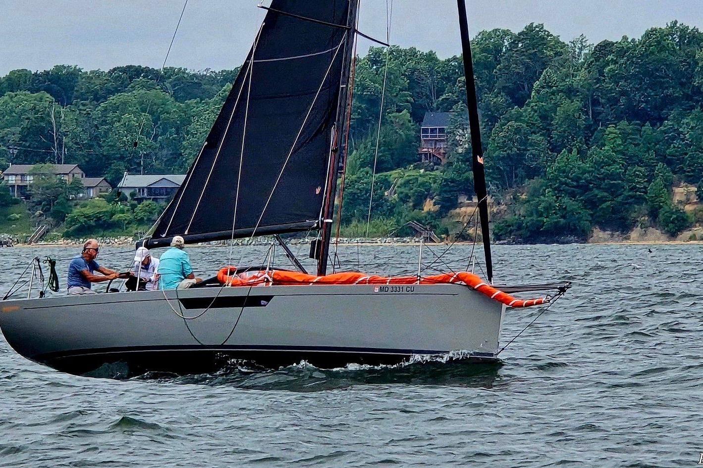Saffier 33 Life 2022 sailboat on water with lush green shoreline background.