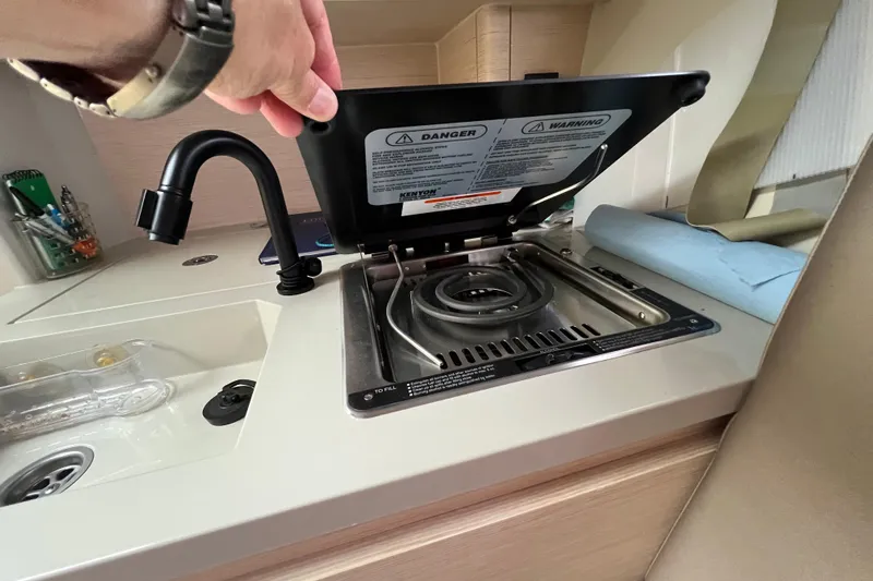 Saffire Yacht Photos Pics Compact kitchen area in 2022 Saffier 33 Life yacht with stove and sink.