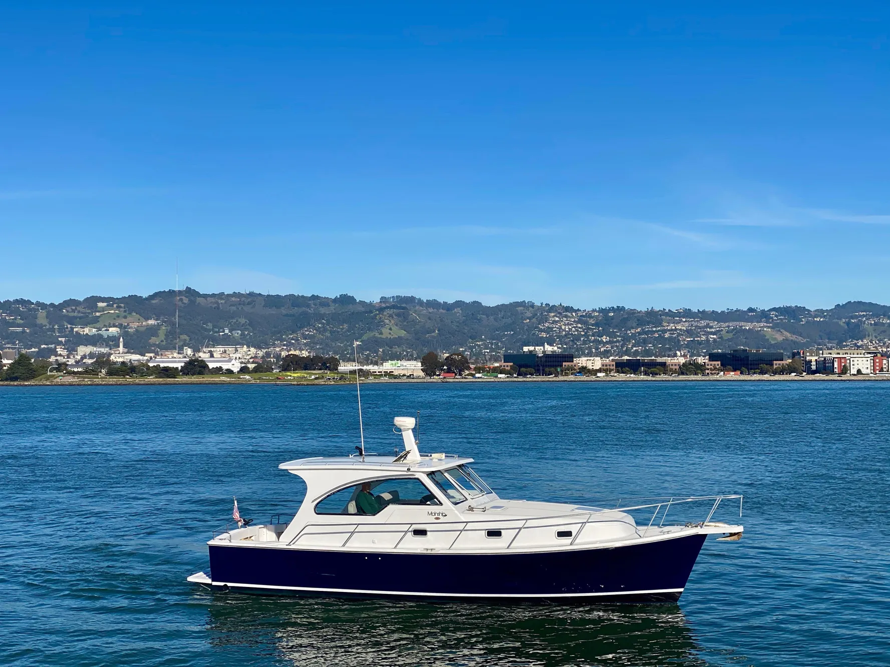 2000 Mainship Pilot 34 boat on calm waters.