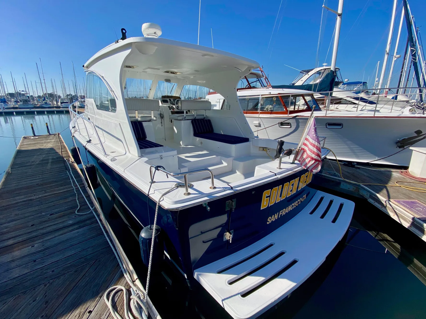 2000 Mainship Pilot 34 boat docked at marina.
