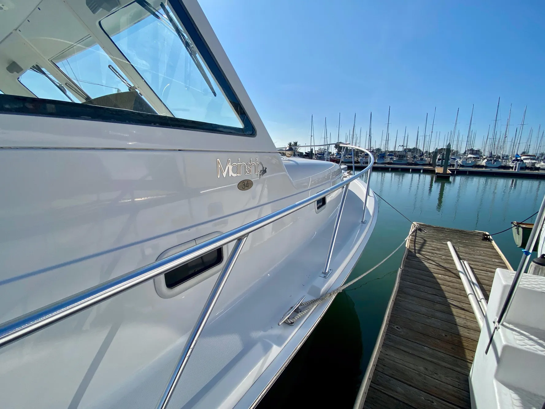 2000 Mainship Pilot 34 at dock, sunny day.