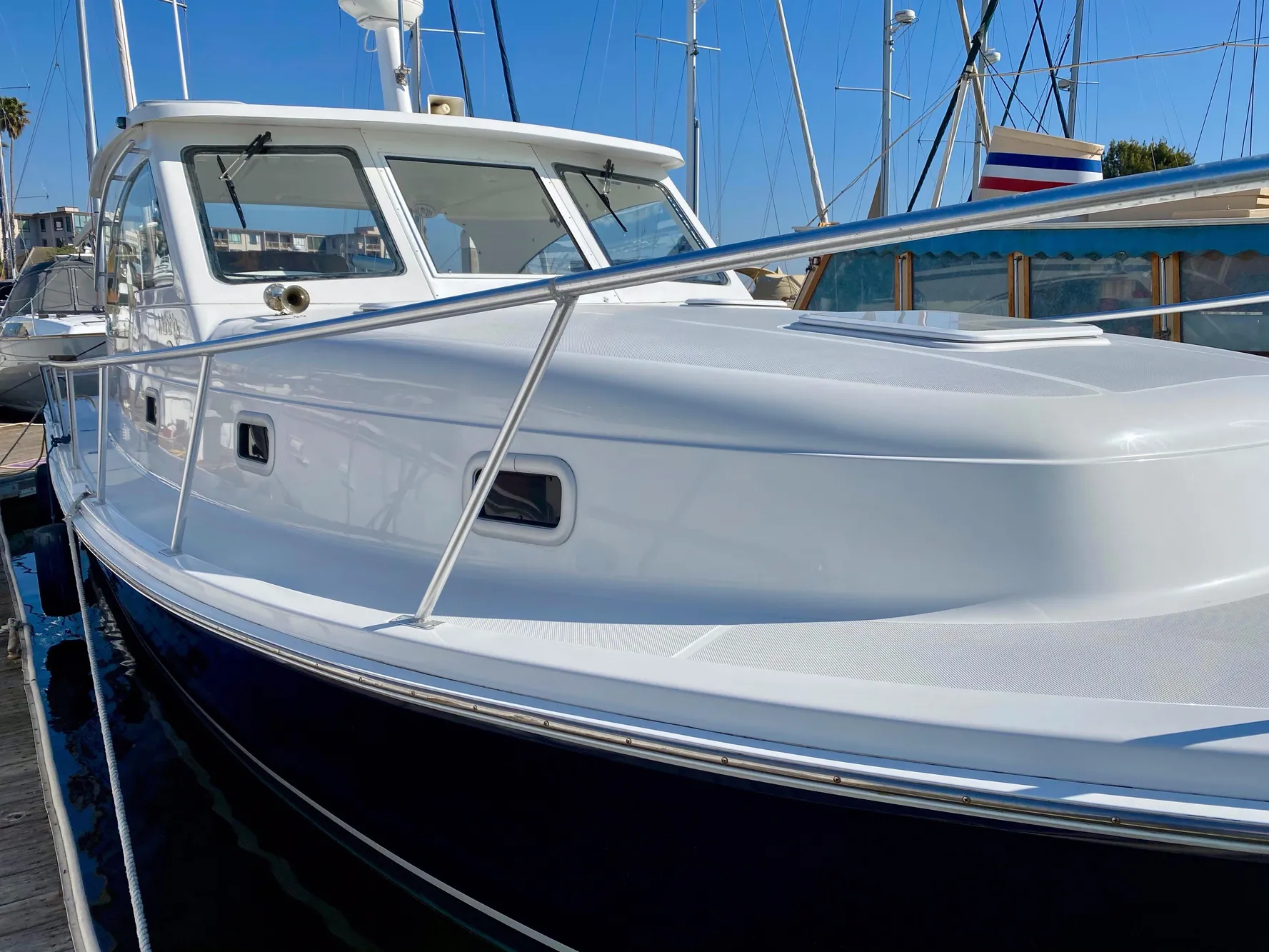 2000 Mainship Pilot 34 boat docked in harbor.