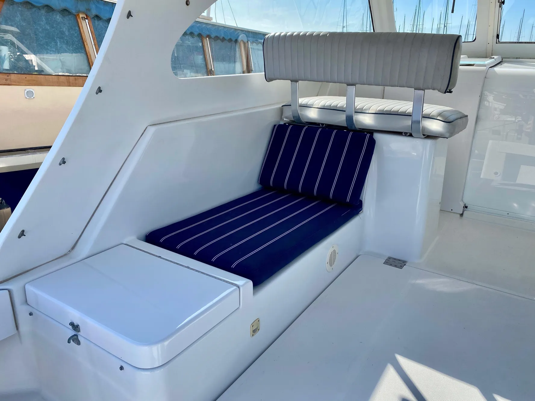 Interior of a 2000 Mainship Pilot 34 yacht with blue cushions.
