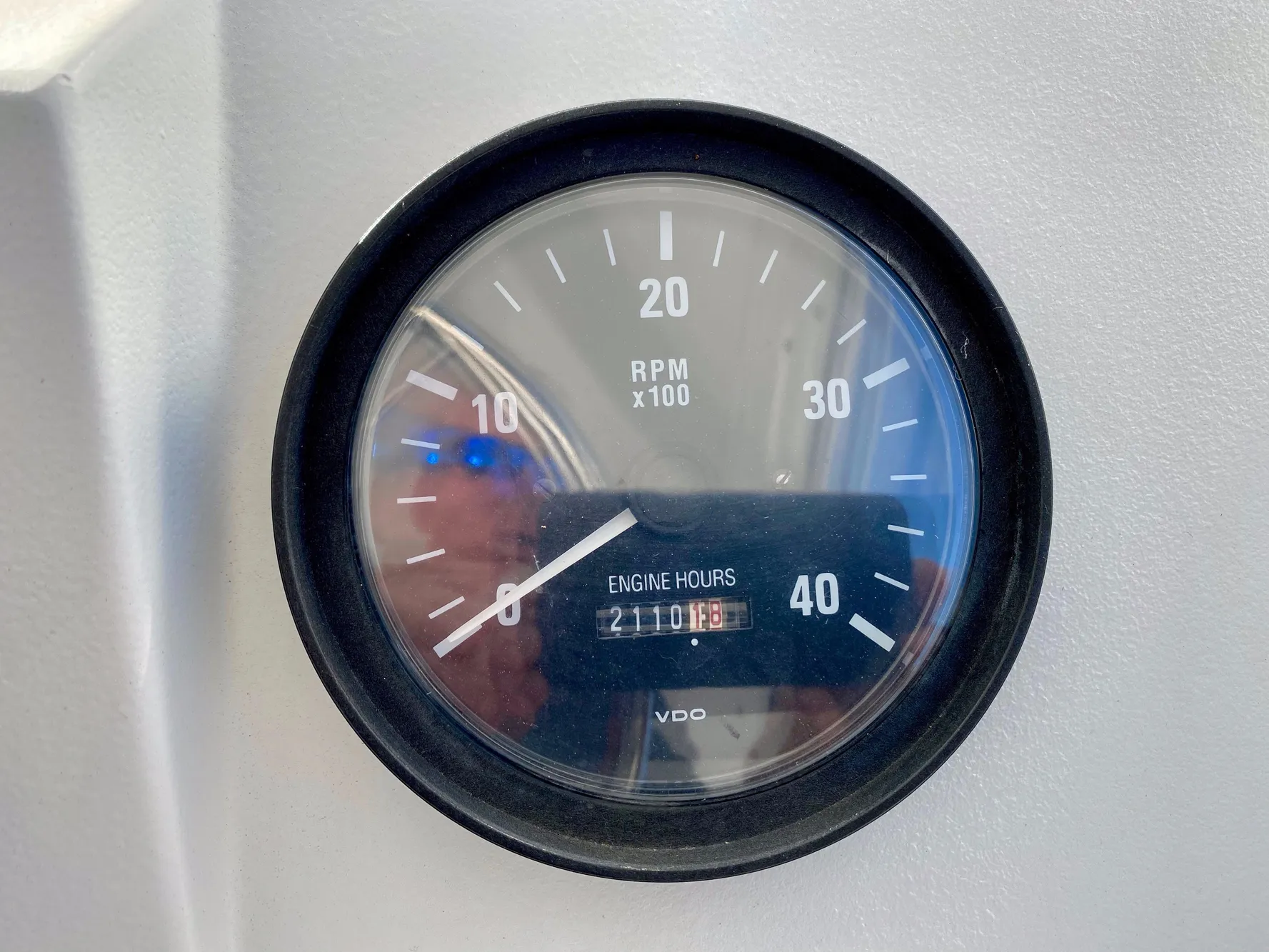 Tachometer of a 2000 Mainship Pilot 34 showing 2110 engine hours.