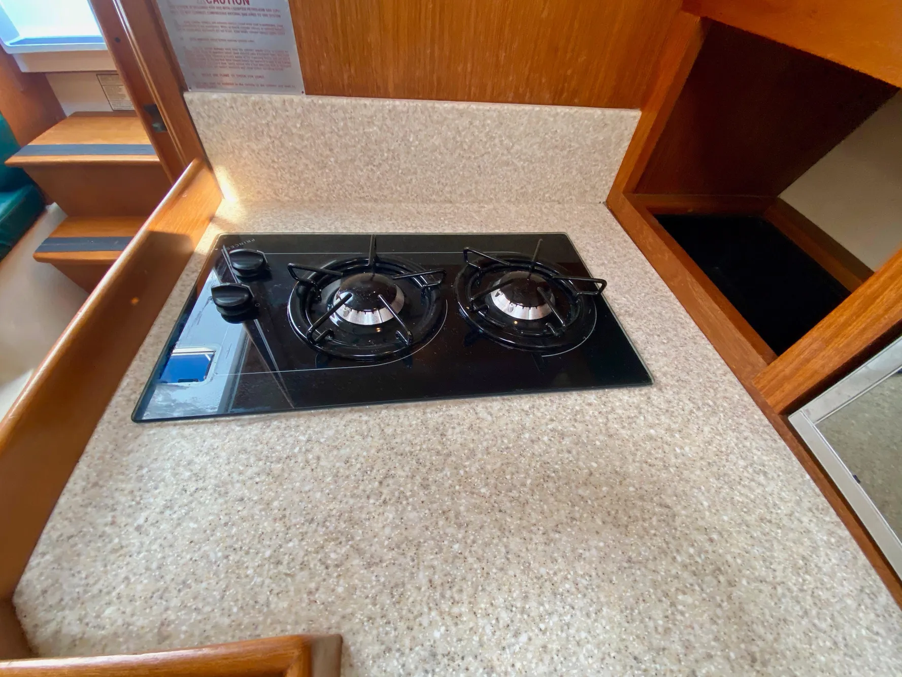 2000 Mainship Pilot 34 kitchen area with gas stove.