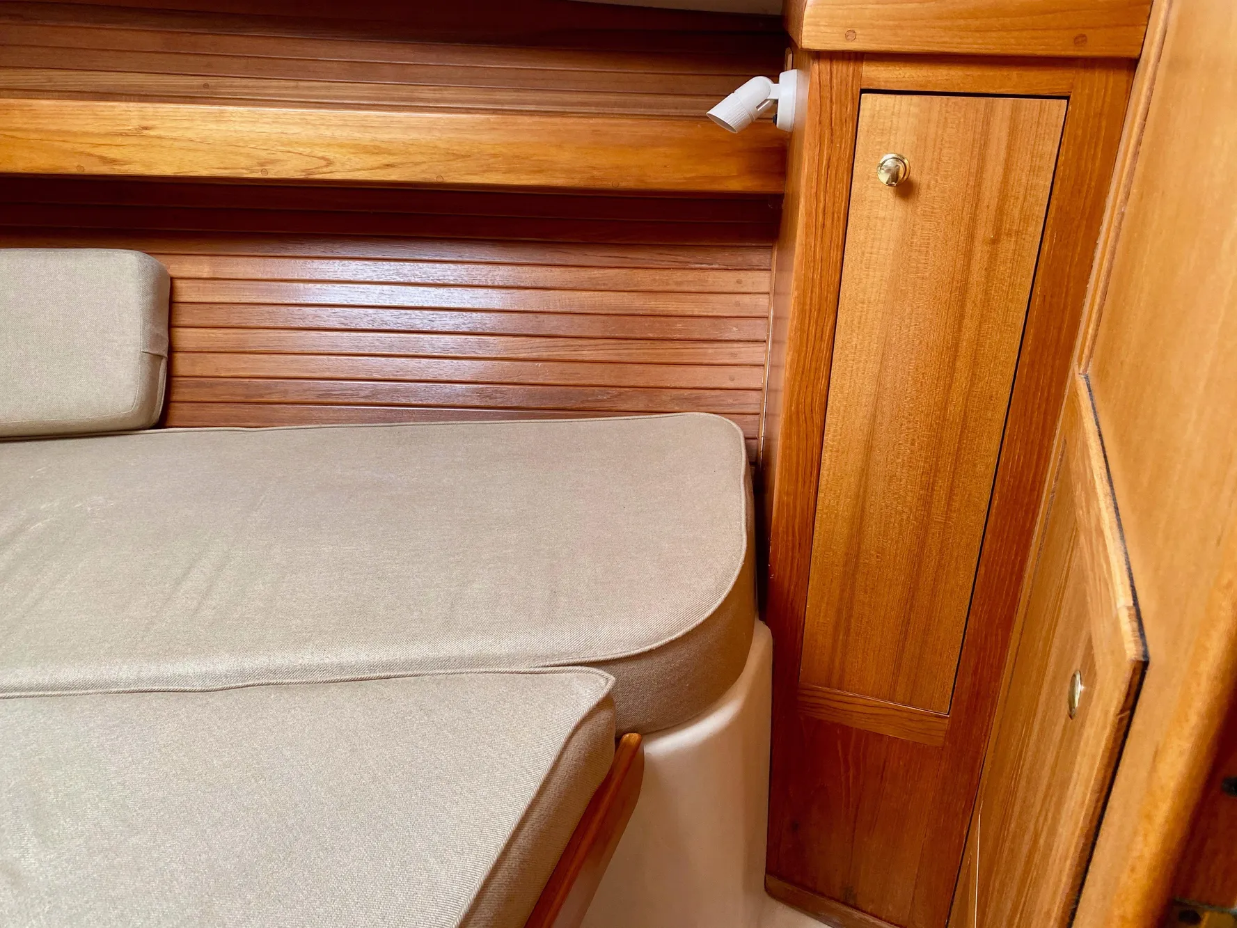 Interior of a 2000 Mainship Pilot 34 yacht with wooden finish.