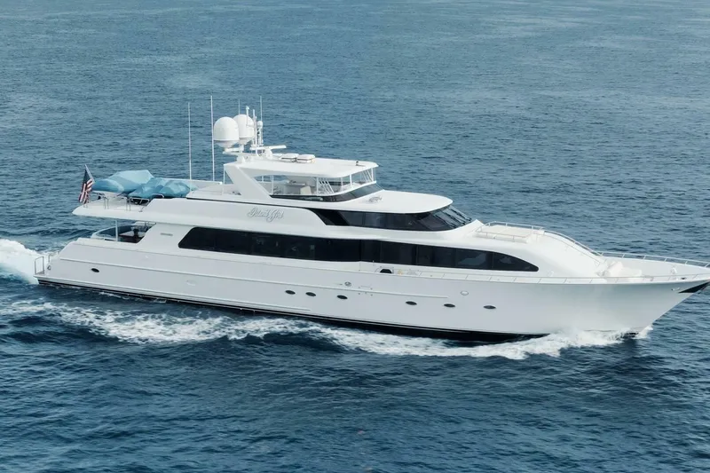 Island Girl Yacht Photos Pics Luxurious 2002 Westport 112 yacht cruising on open sea.