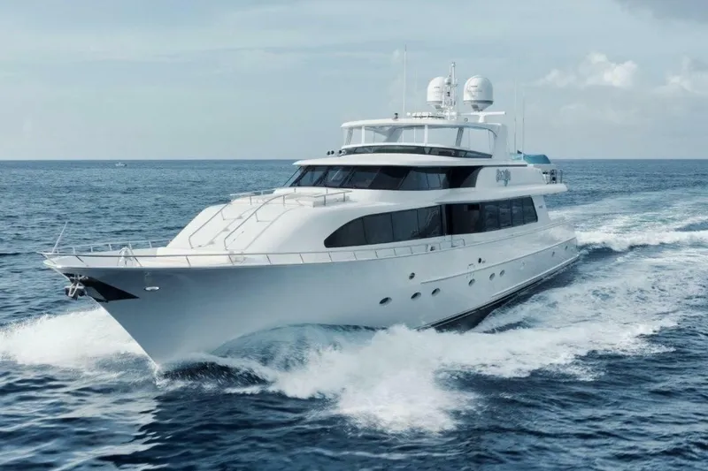 Island Girl Yacht Photos Pics Luxurious 2002 Westport 112 yacht cruising on open sea under clear skies.