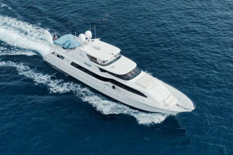 Island Girl Yacht Photos Pics Luxurious 2002 Westport 112 yacht cruising on open blue sea.