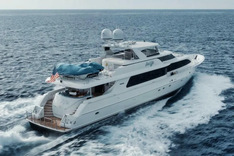 Island Girl Yacht Photos Pics Luxurious 2002 Westport 112 yacht cruising on open sea, displaying elegance and style.