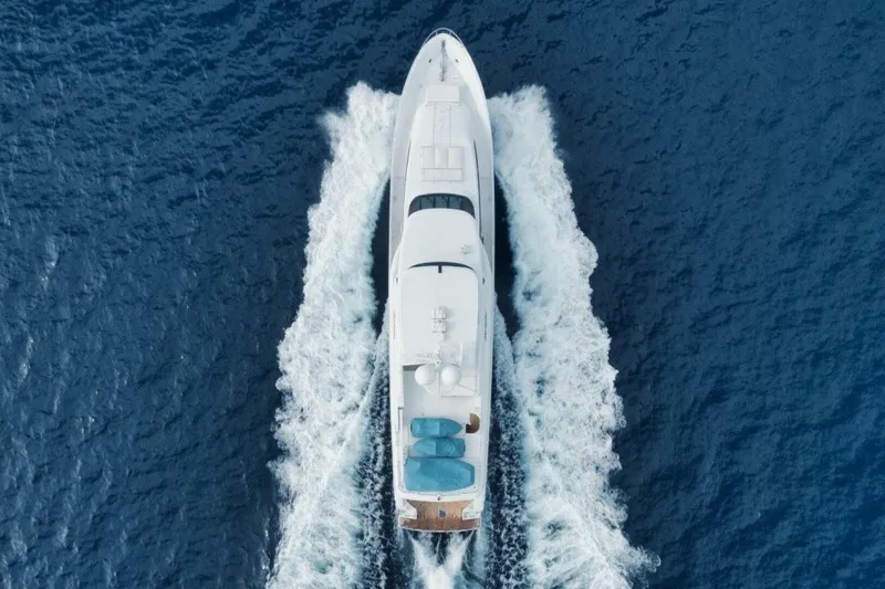 Island Girl Yacht Photos Pics Aerial view of 2002 Westport 112 yacht cruising through blue ocean waters.