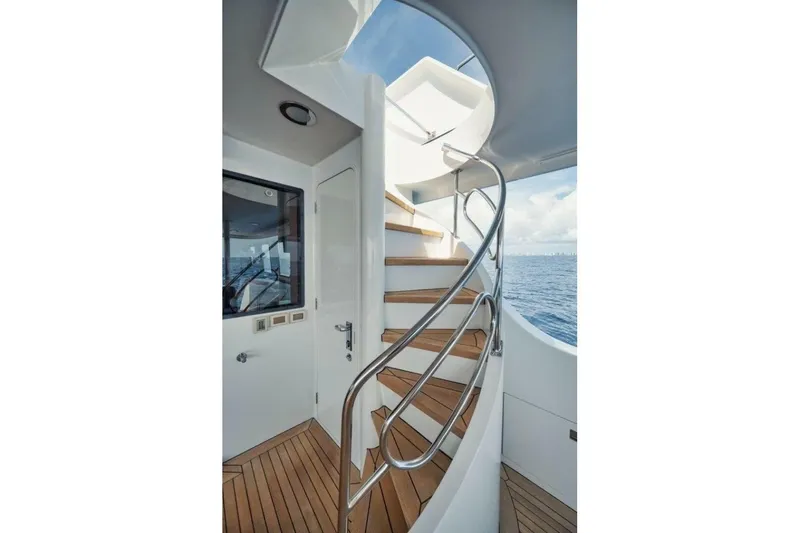 Island Girl Yacht Photos Pics Elegant spiral staircase on 2002 Westport 112 yacht with ocean view.