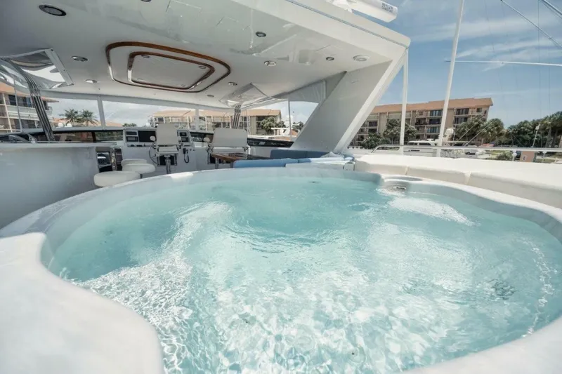 Island Girl Yacht Photos Pics Luxurious 2002 Westport 112 yacht with spacious deck and inviting jacuzzi.