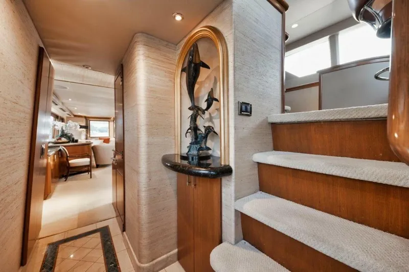 Island Girl Yacht Photos Pics Luxurious interior of 2002 Westport 112 yacht with elegant staircase and decor.