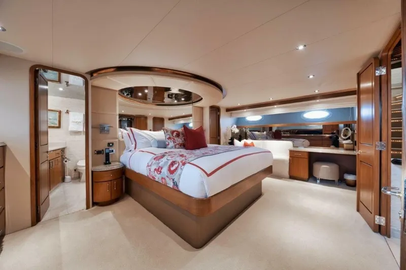Island Girl Yacht Photos Pics Luxurious bedroom interior of 2002 Westport 112 yacht with elegant furnishings and modern design.