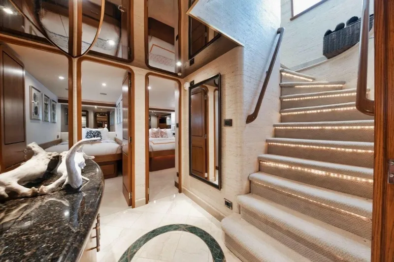 Island Girl Yacht Photos Pics Luxurious interior of 2002 Westport 112 yacht with elegant staircase and modern decor.