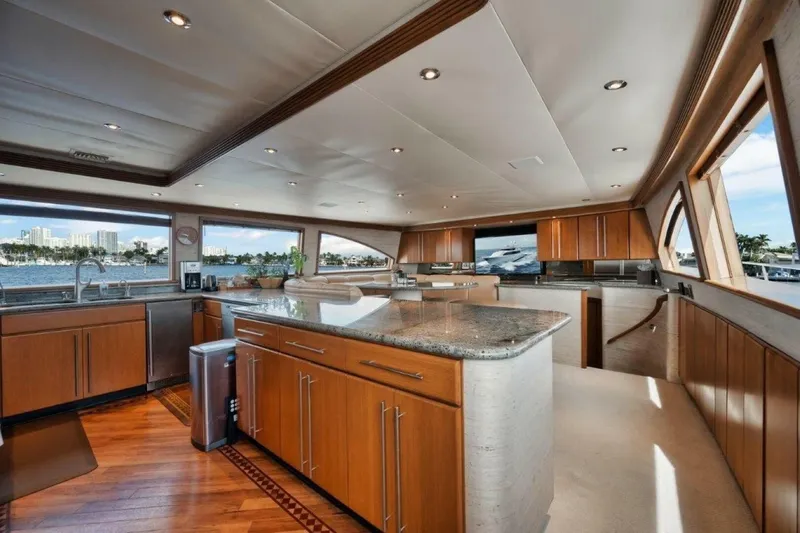 Island Girl Yacht Photos Pics Luxurious kitchen interior of 2002 Westport 112 yacht with wood cabinetry and ocean views.