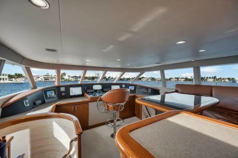 Island Girl Yacht Photos Pics Luxurious interior of 2002 Westport 112 yacht with panoramic windows and modern navigation equipment.