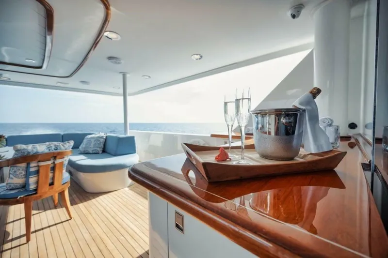 Island Girl Yacht Photos Pics Luxurious 2002 Westport 112 yacht deck with champagne, ocean view, and elegant seating.