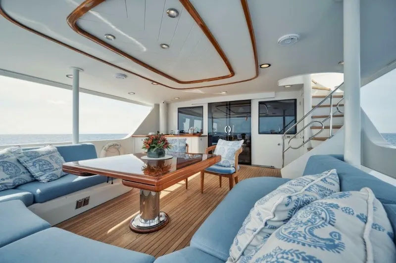 Island Girl Yacht Photos Pics Luxurious 2002 Westport 112 yacht interior with elegant seating and ocean view.