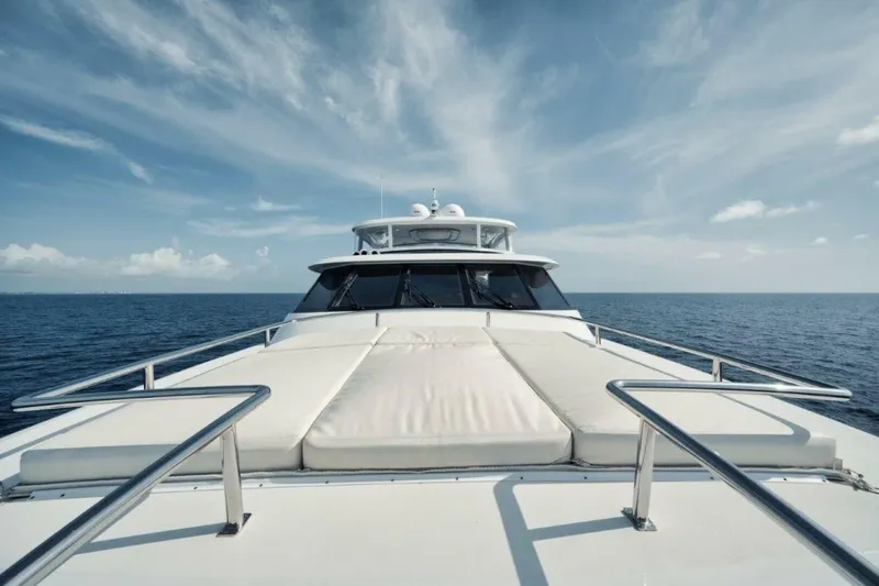 Island Girl Yacht Photos Pics Luxury yacht Westport 112 cruising on open sea under clear blue sky.