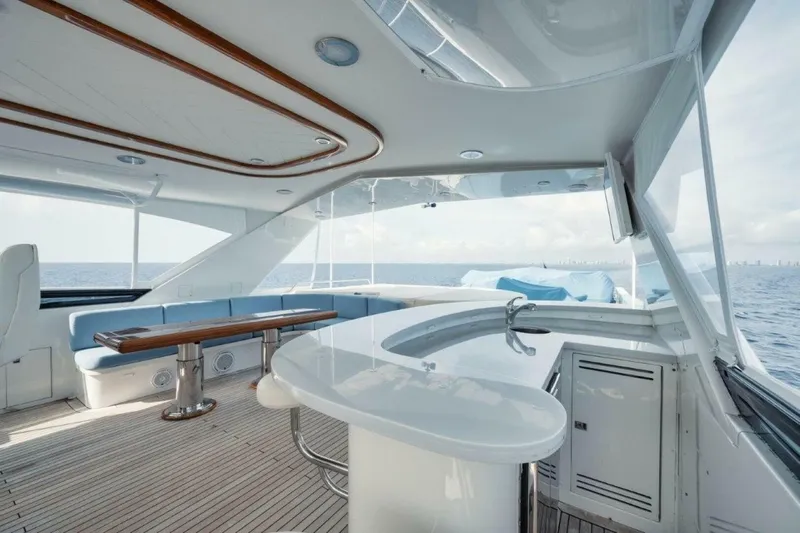 Island Girl Yacht Photos Pics Luxurious 2002 Westport 112 yacht interior with elegant seating and ocean view.