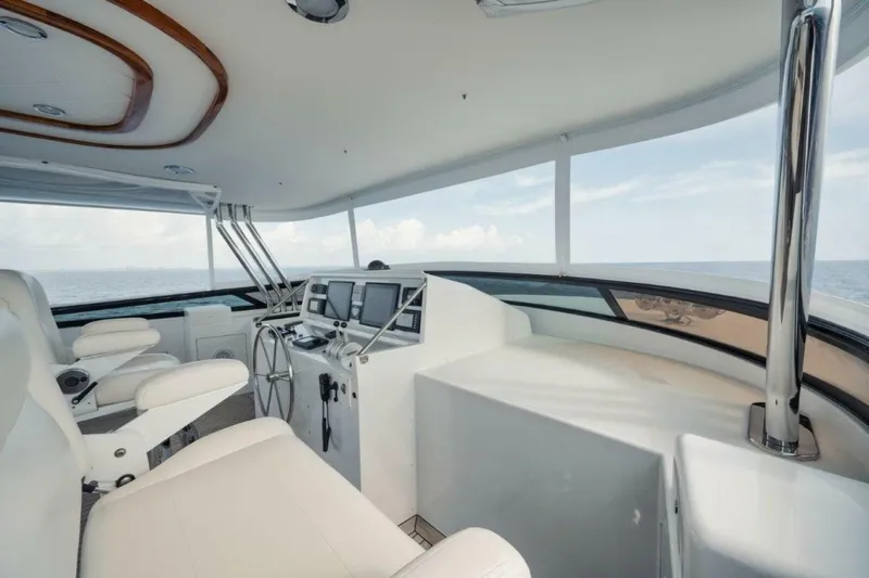 Island Girl Yacht Photos Pics Luxurious helm of 2002 Westport 112 yacht with ocean view and modern controls.