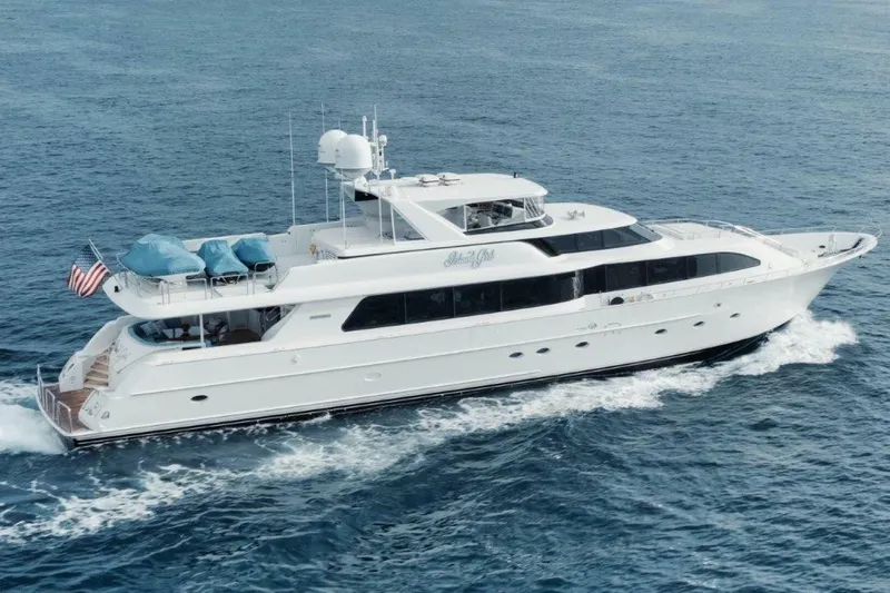 Island Girl Yacht Photos Pics Luxury 2002 Westport 112 yacht cruising on open sea, displaying sleek design and elegance.