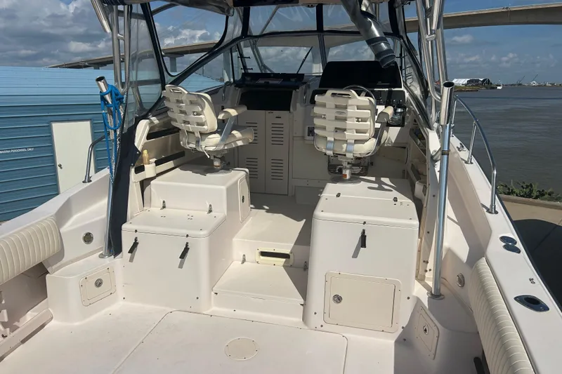  Yacht Photos Pics 2004 Grady-White Marlin 300 boat interior with dual captain chairs and control panel.