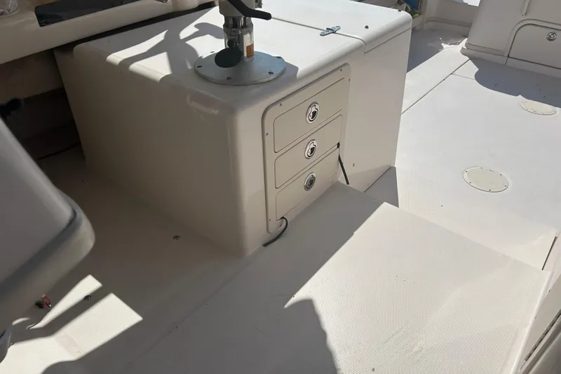 Yacht Photos Pics 2004 Grady-White Marlin 300 boat interior with storage drawers and seating area.