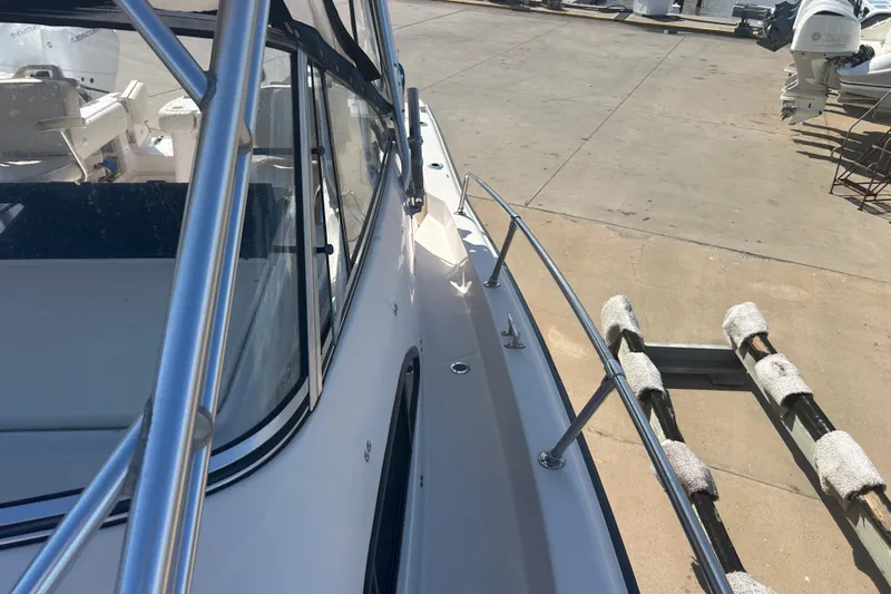  Yacht Photos Pics 2004 Grady-White Marlin 300 boat on trailer, dockside view.