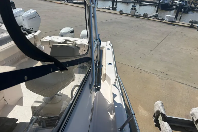  Yacht Photos Pics 2004 Grady-White Marlin 300 boat docked, featuring Mercury engines and spacious deck.