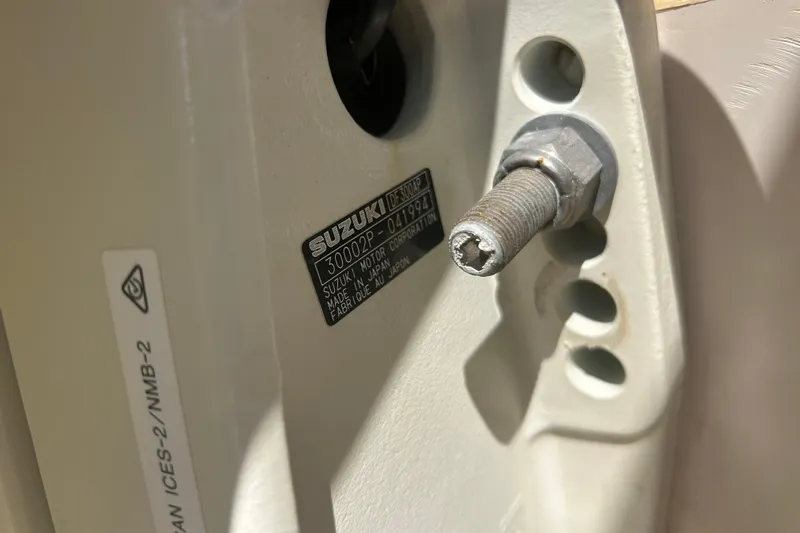  Yacht Photos Pics Close-up of a Suzuki motor part on a 2004 Grady-White Marlin 300 boat.