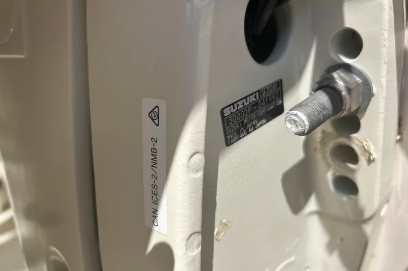  Yacht Photos Pics Close-up of a 2004 Grady-White Marlin 300 boat component with Suzuki label.