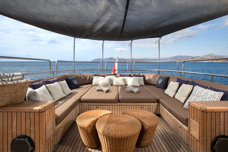 My Mr J Yacht Photos Pics Luxurious seating area on 2006 ISA 120 yacht with ocean view and cushions.