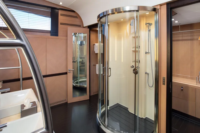 My Mr J Yacht Photos Pics Luxurious yacht bathroom with modern shower, sleek design, and wooden accents, ISA 120, 2006 model.