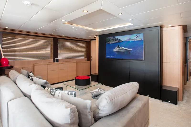My Mr J Yacht Photos Pics Luxurious yacht interior with plush seating, large TV, and modern decor, ISA 120, 2006 model.