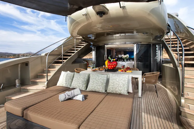 My Mr J Yacht Photos Pics Luxurious 2006 ISA 120 yacht deck with elegant seating and dining area.