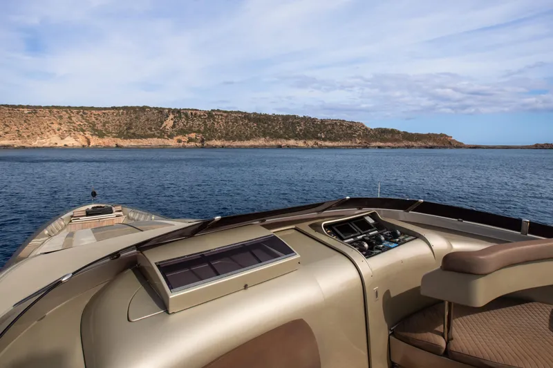 My Mr J Yacht Photos Pics Luxury ISA 120 yacht cruising near rocky coastline, 2006 model.