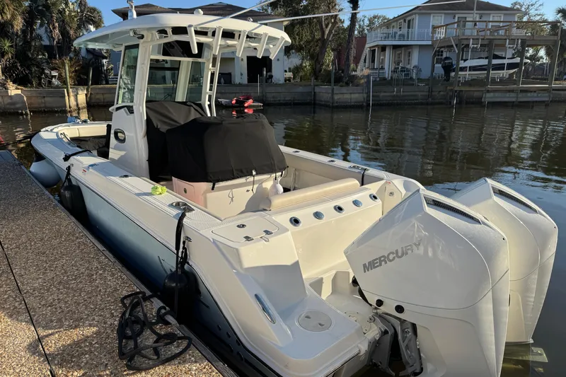  Yacht Photos Pics 2023 Boston Whaler 250 Outrage boat docked with twin Mercury engines.