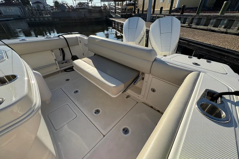  Yacht Photos Pics 2023 Boston Whaler 250 Outrage boat interior with seating and twin engines.