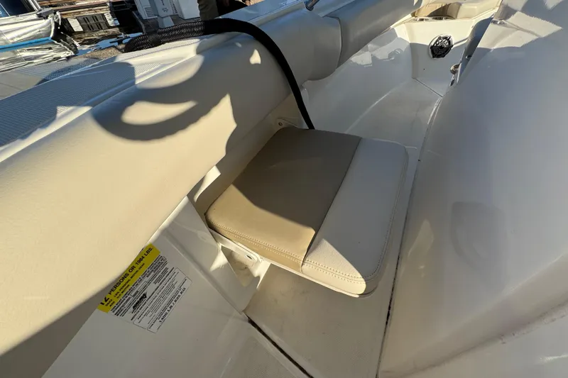  Yacht Photos Pics 2023 Boston Whaler 250 Outrage interior seating detail with beige cushion.