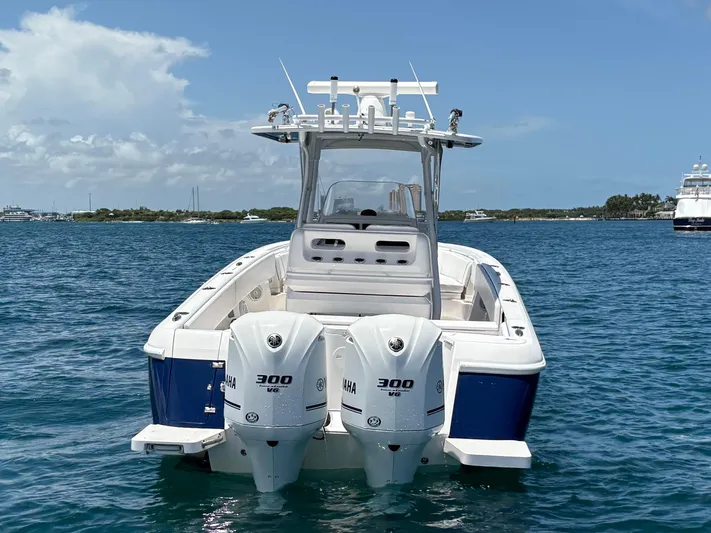 Agitator Yacht Photos Pics 2016 Intrepid 327 Center Console boat with twin Yamaha 300 engines on the water.