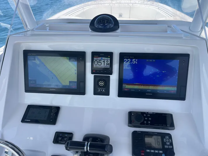 Agitator Yacht Photos Pics 2016 Intrepid 327 Center Console dashboard with Garmin navigation displays and controls.