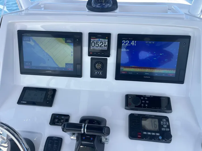 Agitator Yacht Photos Pics 2016 Intrepid 327 Center Console dashboard with Garmin navigation displays and controls.