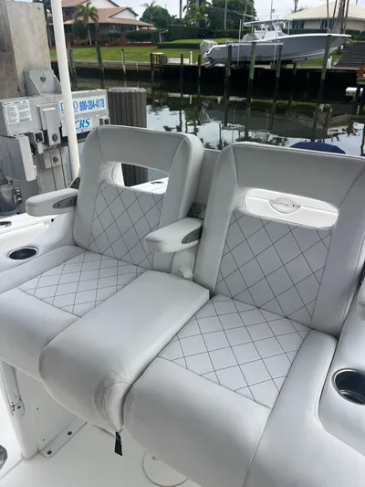 Agitator Yacht Photos Pics 2016 Intrepid 327 Center Console boat seats with diamond-pattern upholstery.