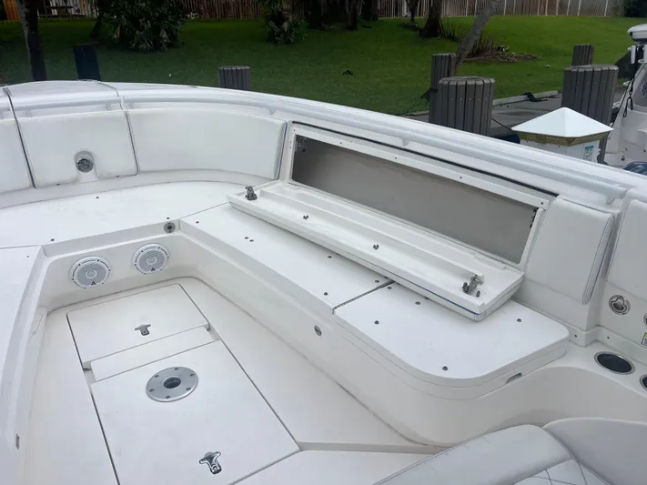 Agitator Yacht Photos Pics 2016 Intrepid 327 Center Console boat interior with storage compartments and speakers.