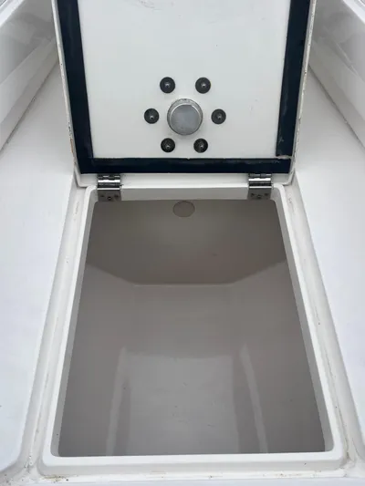 Agitator Yacht Photos Pics Open storage compartment on a 2016 Intrepid 327 Center Console boat.